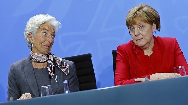 Christine Lagarde, directora gerente del FMI, y Angela Merkel, canciller alemana
