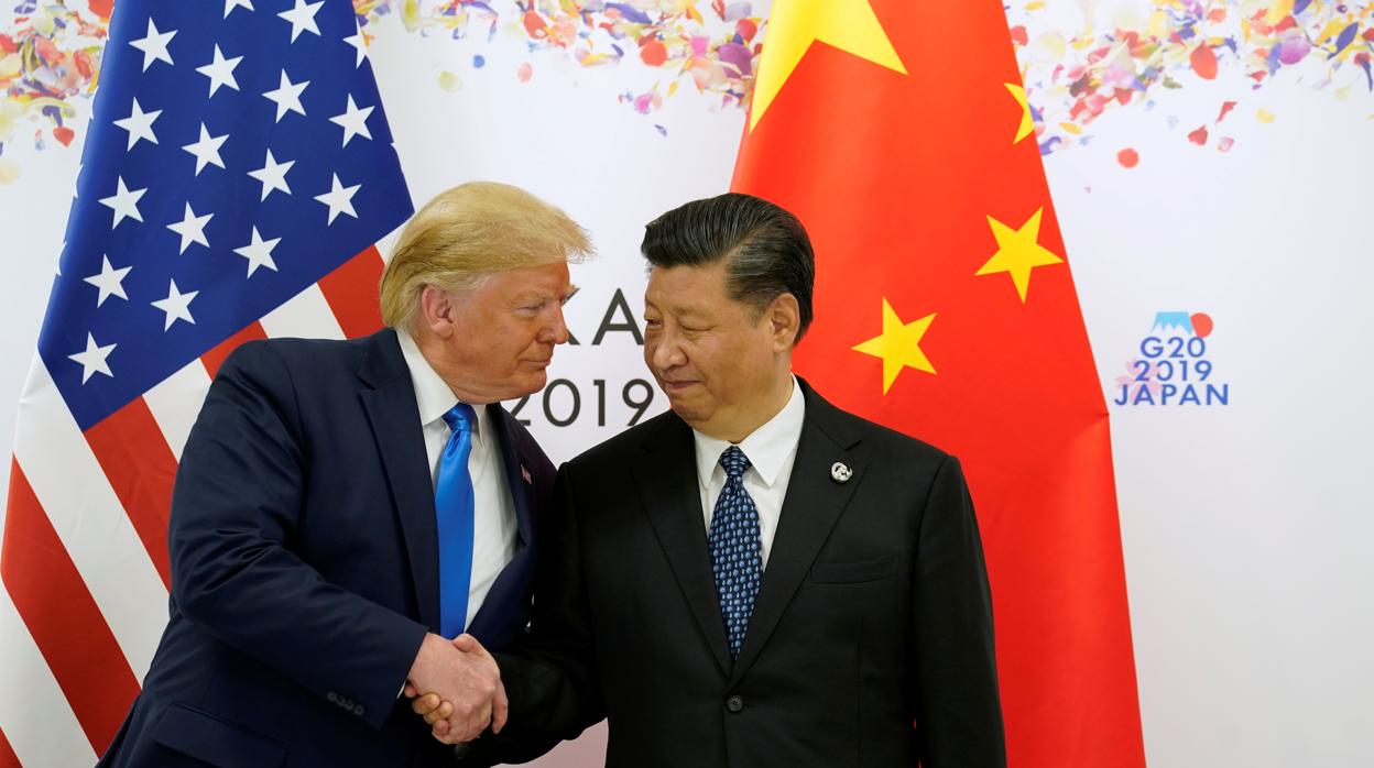 El presidente de EStados Unidos, Donald Trump (izda) y su homólogo chino, Xi Jinping