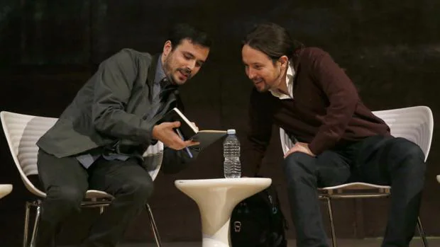 El coordinador federal de IU, Alberto Garzón, y el secretario general de Podemos, Pablo Iglesias