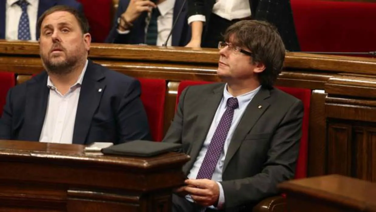 Oriol Junqueras y Carles Puigdemont, en el Parlament