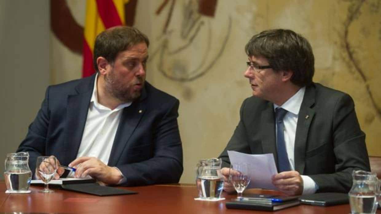 El expresidente Carles Puigdemont y su antiguo números dos en la Generalitat Oriiol Junqueras