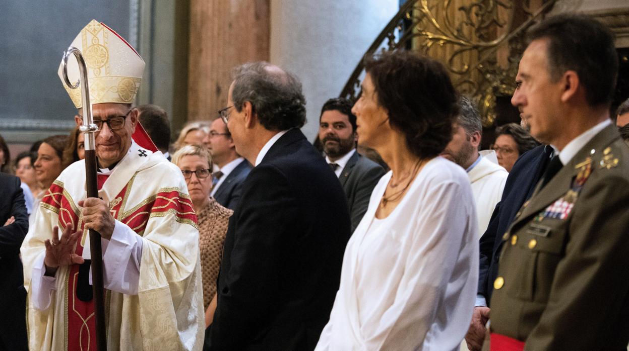 Quim Torra y su esposa, durante la Misa de Fiesta Mayor de la Merced, en Barcelona