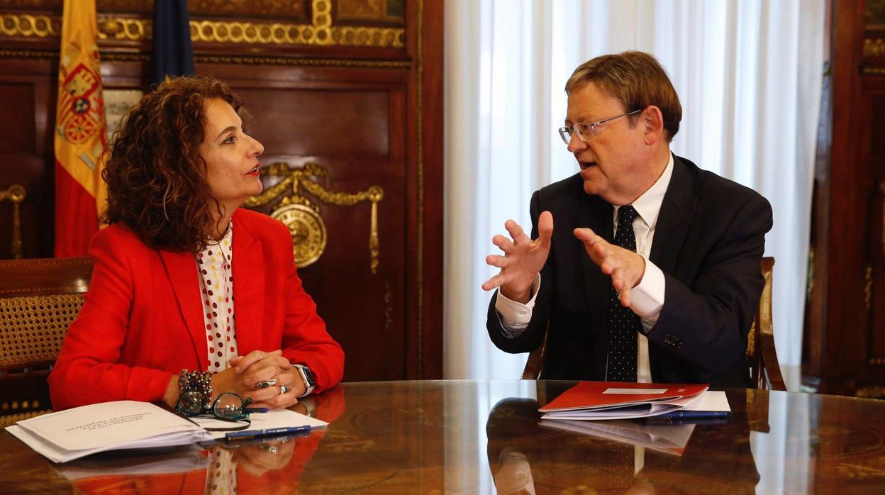 María Jesús Montero y Ximo Puig, durante la reunión de este lunes