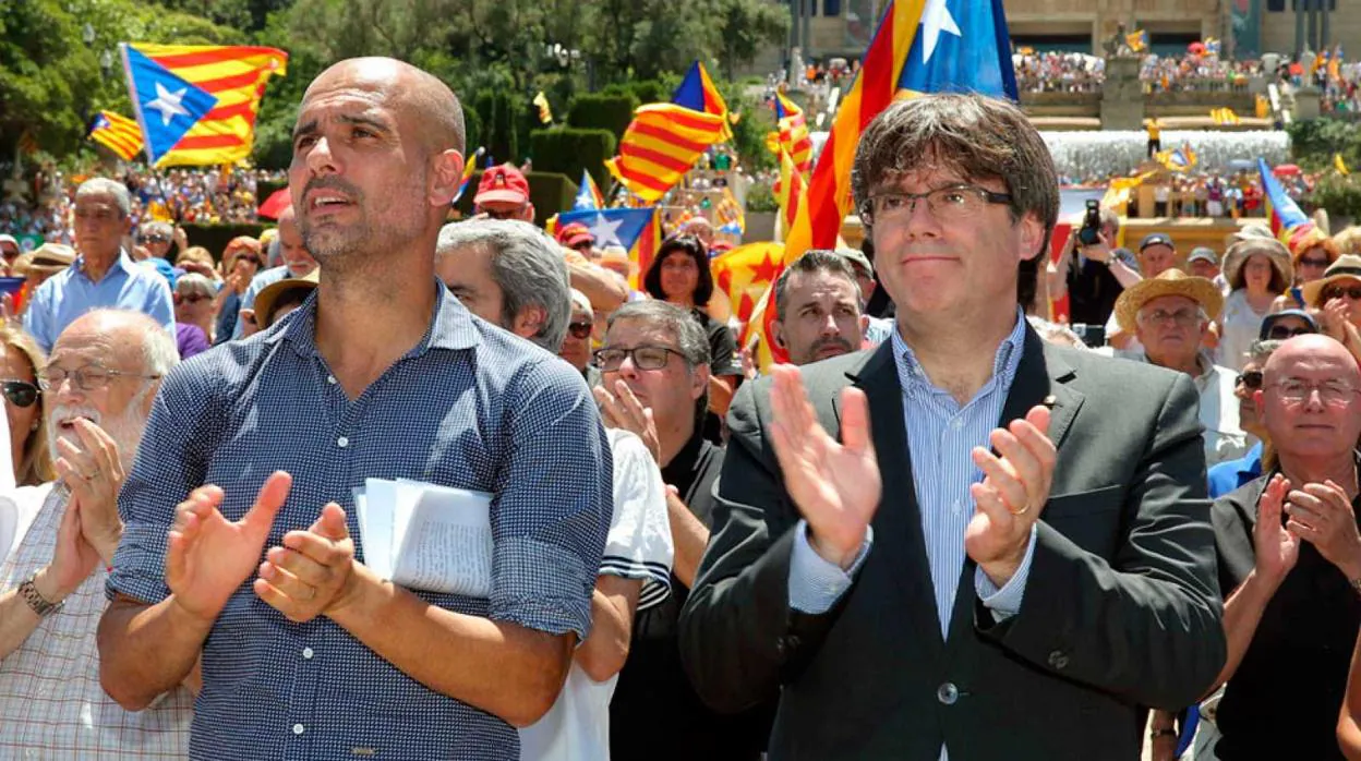 Pep Guardiola, en un acto con Carles Puigdemont