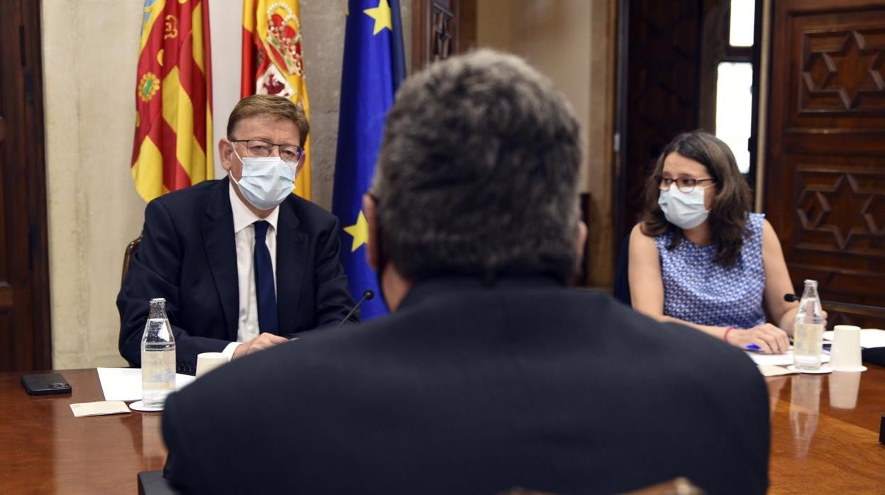 Imagen de la reunión del ministro José Luis Escrivá, el presidente de la Generalitat Ximo Puig y la vicepresidenta Mónica Oltra este jueves en Valencia