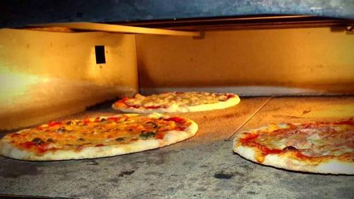 Pizzas de Osteria Milano, en el horno