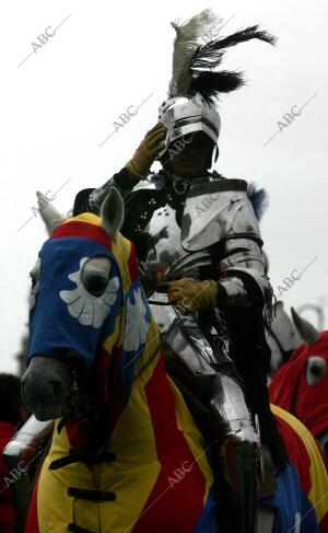 Figurantes participan en la celebración del desfile histórico que recrea la...