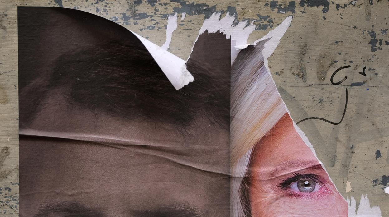 Carteles electorales de Macron y Le Pen