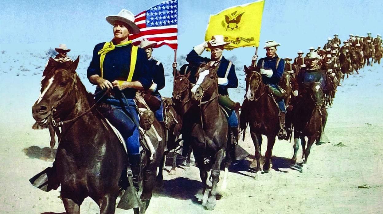 John Ford, en el rodaje de «El álamo», de John Wayne. El cineasta acudió al plató de la película de su actor fetiche y llegó a filmar algunos planos