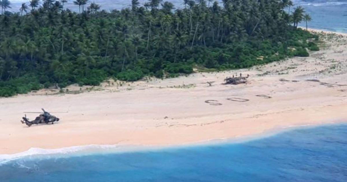 Mensaje escrito sobre el arenal de la playa